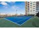Bright blue tennis court with surrounding fencing for a friendly match at 4561 Olde Perimeter Way # 2609, Atlanta, GA 30346