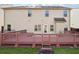 Backyard view with a large wooden deck great for outdoor enjoyment at 3546 Bridge Walk Dr, Lawrenceville, GA 30044