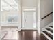 Open foyer with hardwood floors leading to the dining area, showcasing a bright and airy ambiance at 3546 Bridge Walk Dr, Lawrenceville, GA 30044