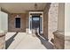 Welcoming front porch with brick columns and a stylish front door, great curb appeal at 3546 Bridge Walk Dr, Lawrenceville, GA 30044