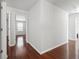Hallway with hardwood floors and neutral walls that leads to other rooms at 3546 Bridge Walk Dr, Lawrenceville, GA 30044