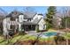 Beautiful backyard featuring a sparkling swimming pool and spa with a well-maintained lawn at 4555 Mystic Dr, Atlanta, GA 30342