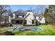Stunning backyard featuring a modern pool, spa, and lush green lawn, perfect for relaxation and outdoor entertaining at 4555 Mystic Dr, Atlanta, GA 30342