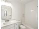 Modern bathroom with white cabinets, quartz counters, a rectangular mirror and a shower and tub combination at 4555 Mystic Dr, Atlanta, GA 30342