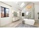 Spacious bathroom featuring a soaking tub, luxurious shower, modern lighting and double vanity at 4555 Mystic Dr, Atlanta, GA 30342