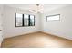 Bedroom with natural light features hardwood floors and a modern ceiling light fixture at 4555 Mystic Dr, Atlanta, GA 30342