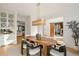 Modern dining room featuring an oval wooden table, stylish chairs, and ample natural light at 4555 Mystic Dr, Atlanta, GA 30342