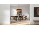 Bright dining room with modern lighting, an oval table, and neutral color palette at 4555 Mystic Dr, Atlanta, GA 30342