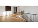 Open hallway with beautiful hardwood floors, decorative railings, and ample natural light at 4555 Mystic Dr, Atlanta, GA 30342