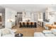 Gourmet kitchen boasts a large center island with bar seating, white cabinetry, and high-end stainless steel appliances at 4555 Mystic Dr, Atlanta, GA 30342