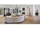 Open living room featuring a fireplace, curved sofas, and large windows at 4555 Mystic Dr, Atlanta, GA 30342