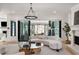 Open concept living room with fireplace, hardwood floors, and glass doors leading to outdoor space at 4555 Mystic Dr, Atlanta, GA 30342