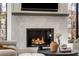Living room with fireplace and marble surround, creating a cozy and elegant space at 4555 Mystic Dr, Atlanta, GA 30342
