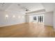 Spacious living room with elegant wall sconces, coffered ceilings, and French doors that let in natural light at 4555 Mystic Dr, Atlanta, GA 30342