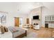 Spacious main bedroom with fireplace, wet bar, herringbone wood floors and barn door entry to bathroom at 4555 Mystic Dr, Atlanta, GA 30342