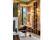 Inviting office with custom bookshelves, fireplace, natural light, and comfortable seating at 4555 Mystic Dr, Atlanta, GA 30342