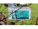 Aerial view of a rectangular pool featuring an integrated spa and clean stone patio at 4555 Mystic Dr, Atlanta, GA 30342