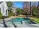 Backyard pool with spa, waterfall features, and well-manicured landscaping at 4555 Mystic Dr, Atlanta, GA 30342