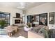 Bright sunroom with white brick walls, fireplace, skylights, and access to the outdoors at 4555 Mystic Dr, Atlanta, GA 30342