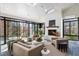 Inviting sunroom with fireplace, skylights, and large windows offering outdoor views at 4555 Mystic Dr, Atlanta, GA 30342