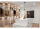 This walk-in closet boasts custom shelving with LED lighting and center island with marble counter at 4555 Mystic Dr, Atlanta, GA 30342