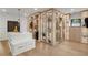 Spacious walk-in closet features custom shelving with LED lighting and a central island at 4555 Mystic Dr, Atlanta, GA 30342