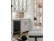 Close-up of bedroom wet bar with wine cooler, white cabinets, and storage at 4555 Mystic Dr, Atlanta, GA 30342