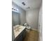 Bathroom with gray vanity, tile floor and standard toilet at 4807 Hairston, Stone Mountain, GA 30088
