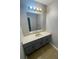 Bathroom featuring neutral vanity with an oval sink and tile floor at 4807 Hairston, Stone Mountain, GA 30088