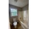 Bathroom with tile floors and a standard bathtub and toilet at 4807 Hairston, Stone Mountain, GA 30088