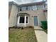 Inviting townhome featuring neutral siding, bright windows, and a well-maintained front yard at 4807 Hairston, Stone Mountain, GA 30088