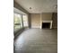 Bright living room featuring a bay window, fireplace and gray tile flooring at 4807 Hairston, Stone Mountain, GA 30088