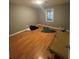 Standard bedroom features gleaming wood floors, neutral paint and a window for natural light at 4762 Old Highgate Entry, Stone Mountain, GA 30083