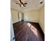 Bedroom with hardwood floors, ceiling fan, and natural light from window at 413 Chippewa Se Dr, Acworth, GA 30102