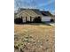 Charming single-story home with well-maintained lawn and attached two-car garage at 413 Chippewa Se Dr, Acworth, GA 30102