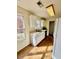 Bright and functional kitchen with ample counter space, white cabinets, and a sunlit window at 413 Chippewa Se Dr, Acworth, GA 30102