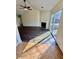 Spacious living room with fireplace, ceiling fan and sliding glass doors to the backyard at 413 Chippewa Se Dr, Acworth, GA 30102