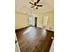 Bright main bedroom features hardwood floors, a ceiling fan, and an en-suite bathroom at 413 Chippewa Se Dr, Acworth, GA 30102