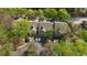 Aerial view of a condominium building surrounded by lush green trees and parking at 446 Mcgill Ne, Atlanta, GA 30312