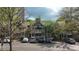 Condominium building with ample parking, balconies, and mature trees at 446 Mcgill Ne, Atlanta, GA 30312