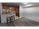 A kitchen with stainless steel appliances, wood cabinets, and a breakfast bar at 446 Mcgill Ne, Atlanta, GA 30312