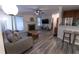 Comfortable living room featuring a fireplace, modern lighting and wood flooring at 446 Mcgill Ne, Atlanta, GA 30312