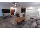 Open-concept living room with fireplace, a breakfast bar, and modern decor at 446 Mcgill Ne, Atlanta, GA 30312