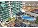 Aerial view showcasing high-rise living, a sparkling pool, and inviting outdoor social spaces at 923 Peachtree Ne St # 1628, Atlanta, GA 30309