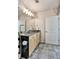 Granite countertop bathroom with updated fixtures and tile floors at 923 Peachtree Ne St # 1628, Atlanta, GA 30309