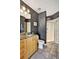 Stylish bathroom with granite countertop, wood cabinets, and a glass-enclosed shower at 923 Peachtree Ne St # 1628, Atlanta, GA 30309