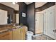 Stylish bathroom with granite countertop, wood cabinets, and a glass-enclosed shower at 923 Peachtree Ne St # 1628, Atlanta, GA 30309