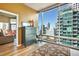 Bedroom featuring a dresser, rug, and large windows with city views at 923 Peachtree Ne St # 1628, Atlanta, GA 30309