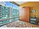 Bedroom featuring a murphy bed, rug, and large windows with city views at 923 Peachtree Ne St # 1628, Atlanta, GA 30309