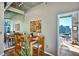 Elegant dining room with a mirrored wall, art piece, and city view at 923 Peachtree Ne St # 1628, Atlanta, GA 30309
